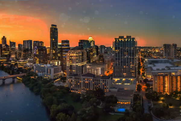 Austin Texas city skyline and river at dusk