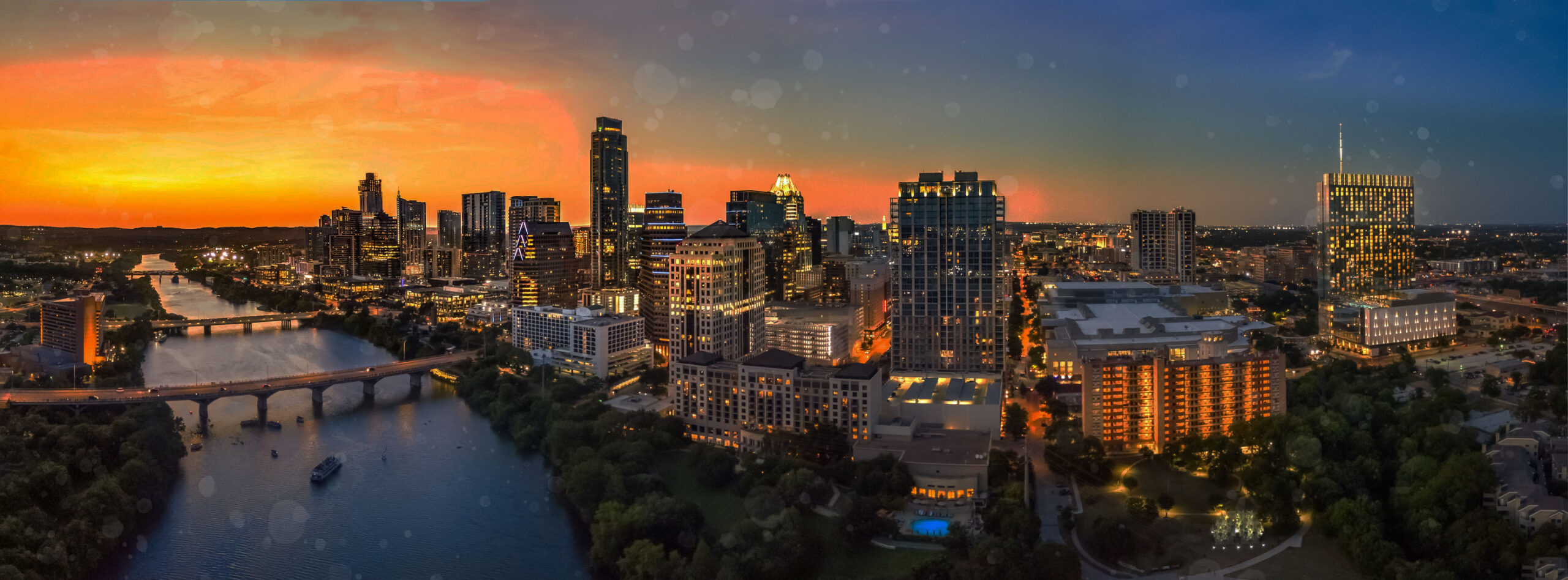 Austin Texas city skyline and river at dusk