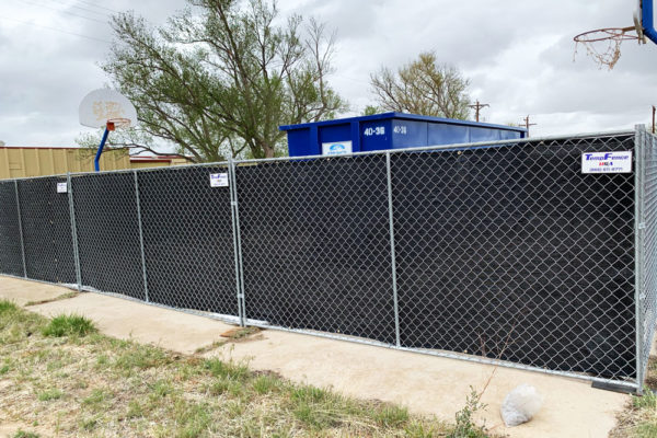 Temporary fence corner at a school in Denver