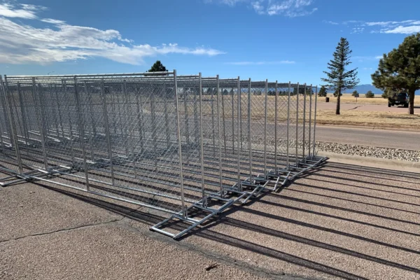 Portable chain-link fence panels staged for installation